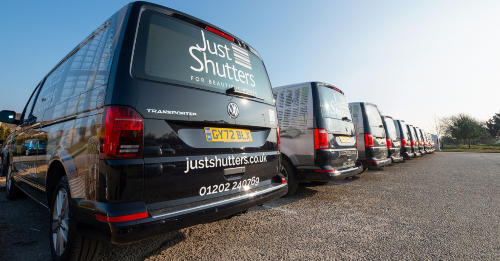 Just Shutters vans in a car park