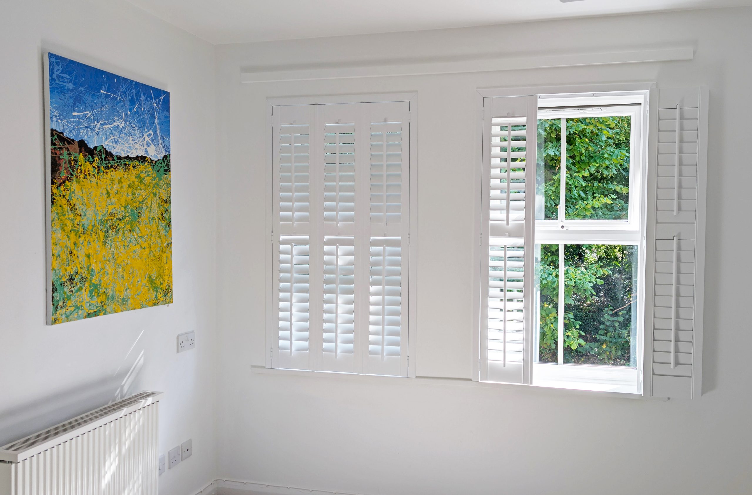 Just Shutters Bristol installation with white plantation shutters adding style and light control to a modern home.